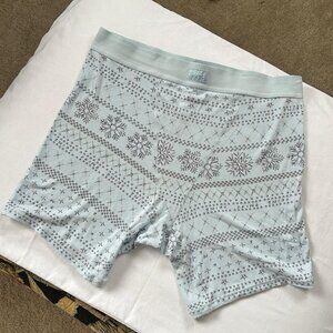 SKIMS winter collection holiday print blue gray white snowflake print boy short